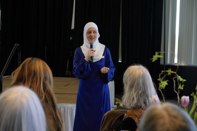Sarene speaking at an event